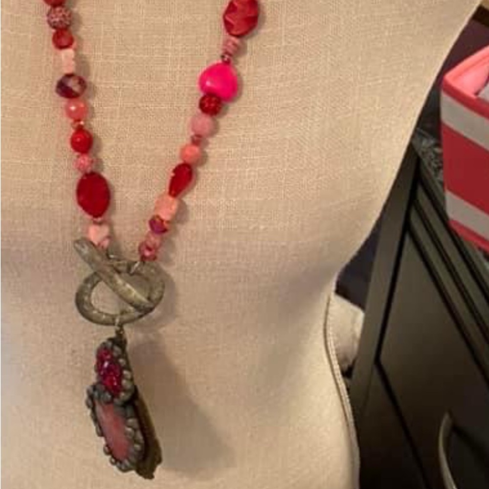 Art by Amy red and pink stones are strung on as your chain pendant with bling.